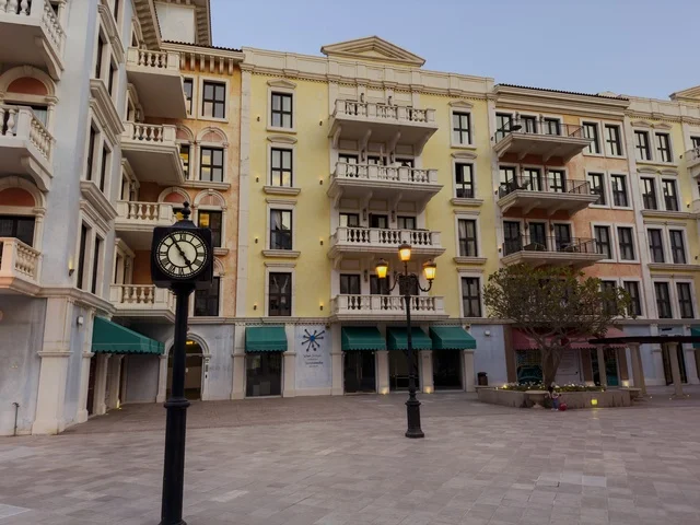 Qanat Quartier canal at The Pearl in Doha showcasing luxury buildings and beautiful reflections on the water. doha.Qatar - February 15 2026 .