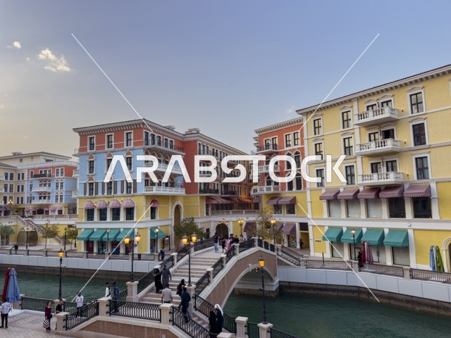 Qanat Quartier canal at The Pearl in Doha showcasing luxury buildings and beautiful reflections on the water. doha.Qatar - February 15 2026 .