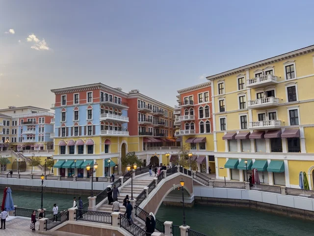 Qanat Quartier canal at The Pearl in Doha showcasing luxury buildings and beautiful reflections on the water. doha.Qatar - February 15 2026 .