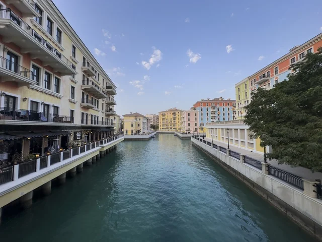 Qanat Quartier canal at The Pearl in Doha showcasing luxury buildings and beautiful reflections on the water. doha.Qatar - February 15 2026 .
