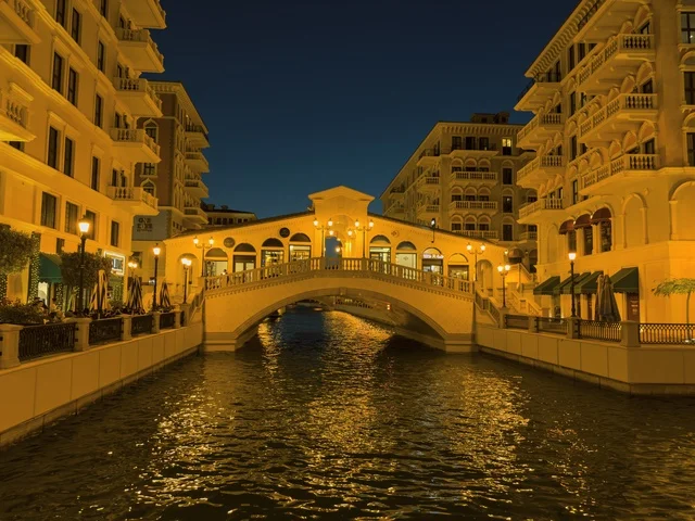 Qanat Quartier canal at The Pearl in Doha showcasing luxury buildings and beautiful reflections on the water. doha.Qatar - February 15 2026 .