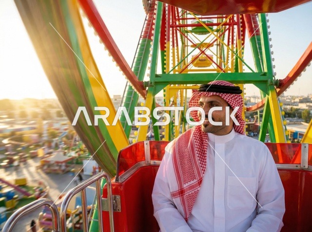 Saudi Man on Ferris Wheel During Eid in Saudi Arabia