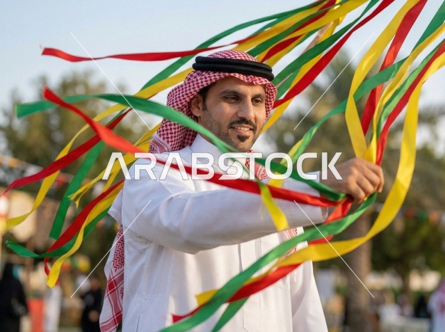 Saudi Man Celebrating Eid with Colorful Ribbons