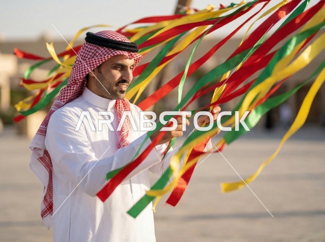 Saudi Man with Colorful Ribbons During Eid Celebration