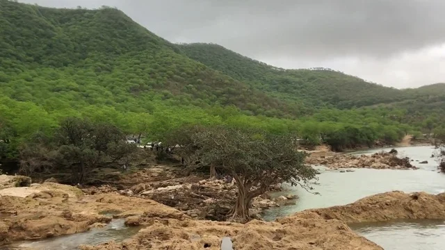 Flowing Wadi in Green Oman Mountains During Monsoon