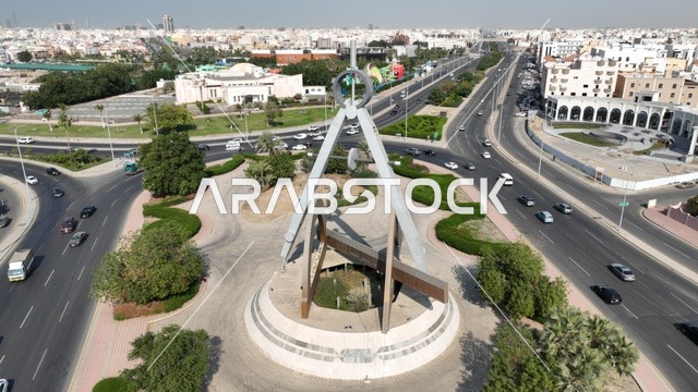 Engineering Roundabout in Jeddah, paved roads and streets in the city, green natural landscapes in the Kingdom of Saudi Arabia.