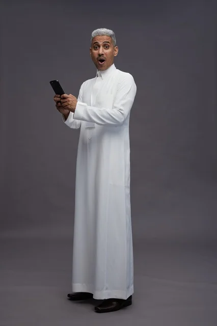 A portrait of an Arab Saudi Gulf man wearing a white thobe using a mobile phone, with various gestures and expressions, full body, gray background. A portrait of an Arab Saudi Gulf man wearing a white thobe using a mobile phone, with various gestures and expressions, full body, gray background.