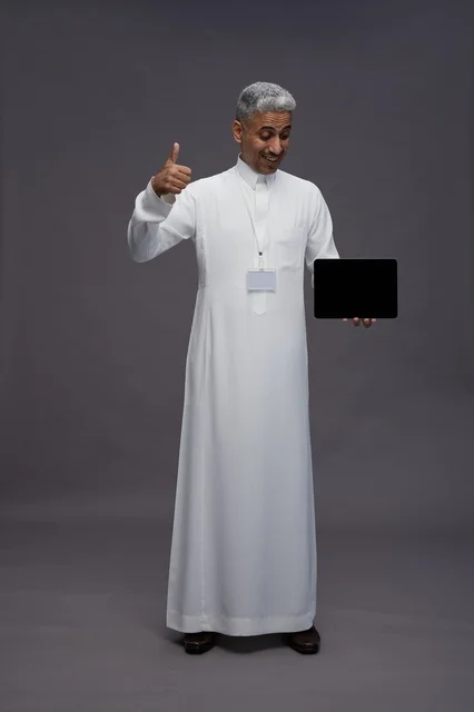 Saudi professional holding blank tablet screen