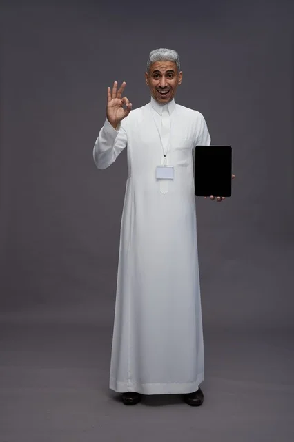 Saudi professional holding blank tablet screen
