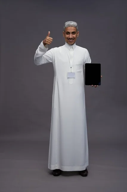 Saudi professional holding blank tablet screen