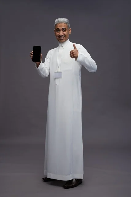 Saudi professional showing blank smartphone screen