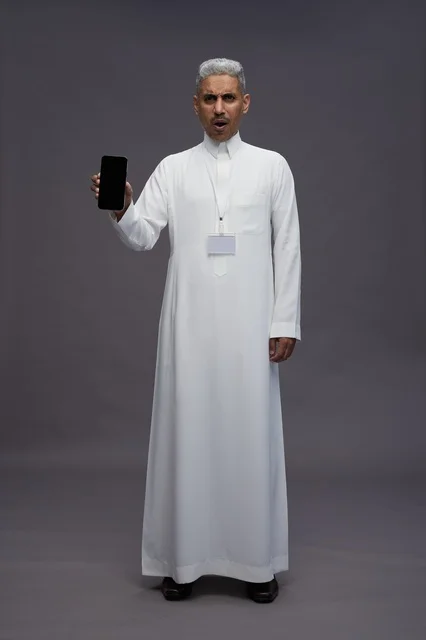 Saudi professional showing blank smartphone screen