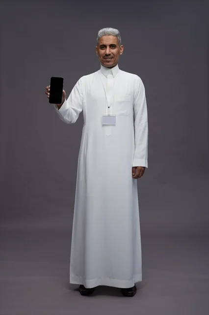 Saudi professional showing blank smartphone screen
