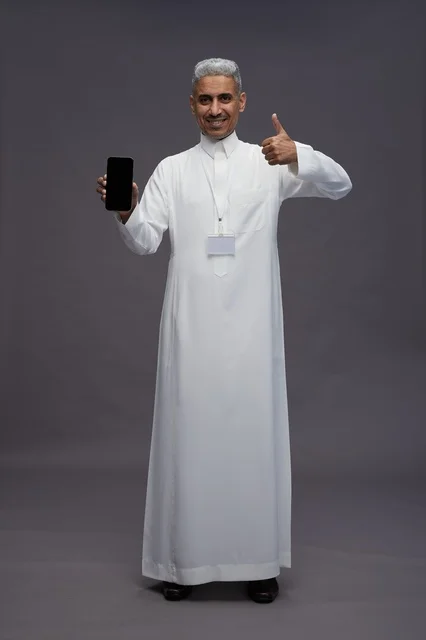 Saudi professional showing blank smartphone screen