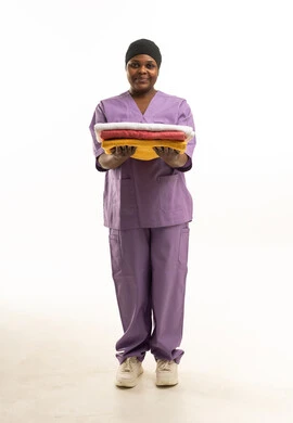 African Female Healthcare Worker in Purple Scrubs