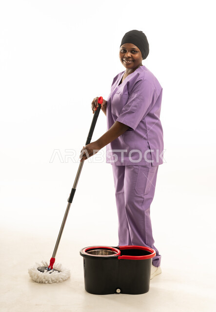 African Female Cleaner in Purple Uniform with Mop