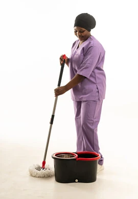 African Female Cleaner in Purple Scrubs with Mop