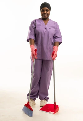 African Female Cleaner in Purple Uniform with Broom