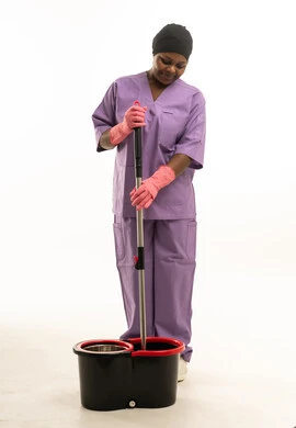 African Female Cleaner with Mop and Bucket in Studio