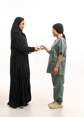 Saudi Woman Paying Cash Salary to Domestic Worker