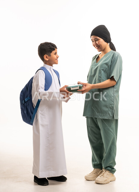 Saudi Boy and Domestic Worker with Lunch Box