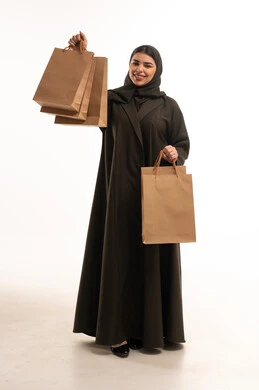 Saudi Woman in Abaya Holding Shopping Bags