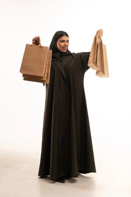 Saudi Woman in Black Abaya Holding Shopping Bags