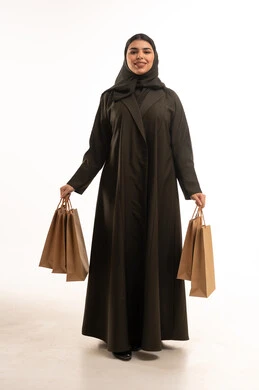 Saudi Woman in Abaya with Shopping Bags