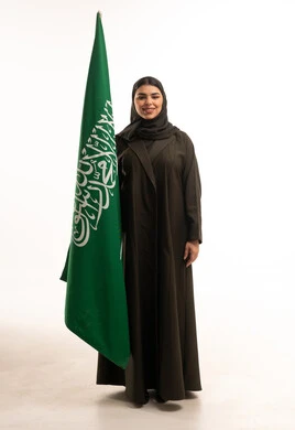 Saudi Woman with Saudi Flag in Black Abaya