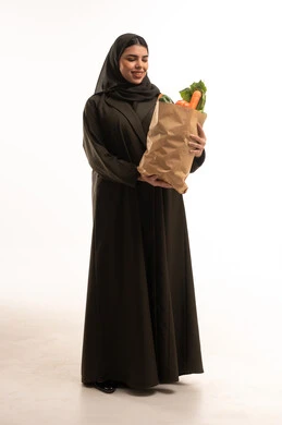 Saudi Woman in Abaya Holding Fresh Grocery Bag