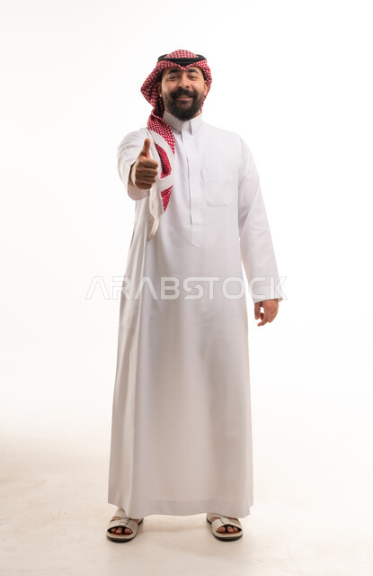 Saudi Man in Traditional Thobe Giving Thumbs Up