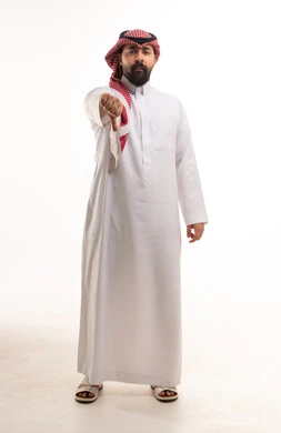 Saudi Man in Thobe Giving Thumbs Down Gesture