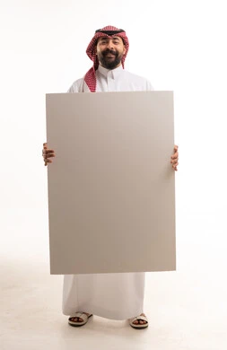 Saudi Man Holding Blank White Board in Studio