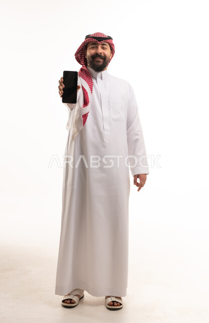 Saudi Man Holding Smartphone on White Background