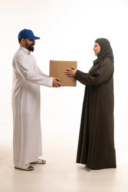 Saudi Delivery Courier Handing Box to Arab Woman