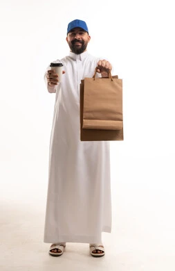 Saudi Man Holding Shopping Bags and Coffee