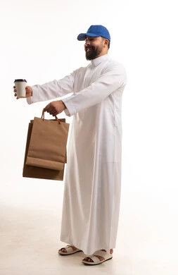 Saudi Man Holding Shopping Bags and Coffee Cup