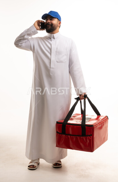 Saudi Delivery Man Talking on Phone with Red Food Bag