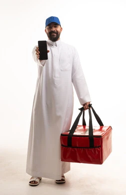 Saudi Delivery Man with Smartphone and Red Bag Studio Shot