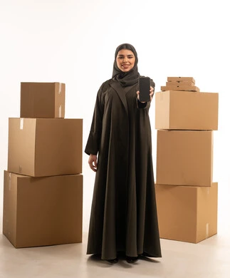 Emirati Woman with Delivery Boxes and Smartphone