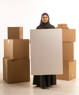 Saudi Woman Holding Blank Sign with Moving Boxes