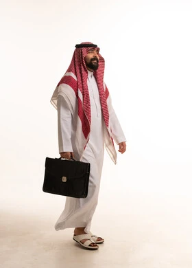 Saudi Businessman Walking with Briefcase on White Background