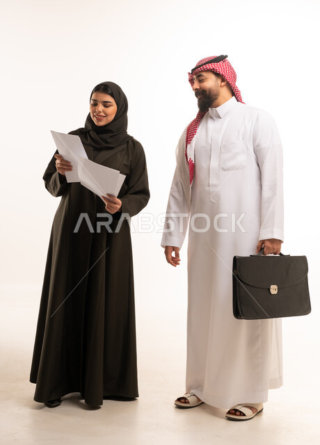 Saudi Business Colleagues Reviewing Documents