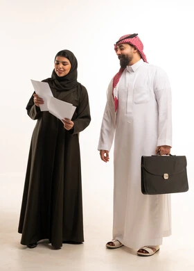 Saudi Business Colleagues Reviewing Documents