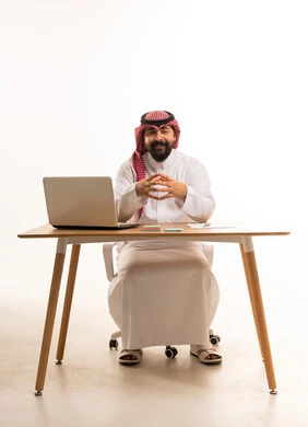 Saudi Businessman at Office Desk with Laptop