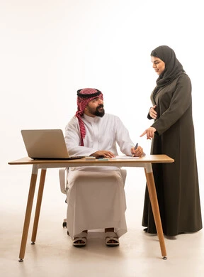 Saudi Businessman and Woman Working in Office