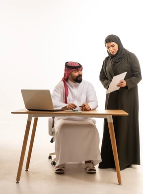 Saudi Businessman and Woman Working in Modern Office