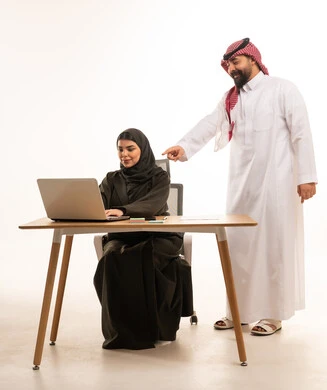 Saudi Business Colleagues Working on Laptop in Studio