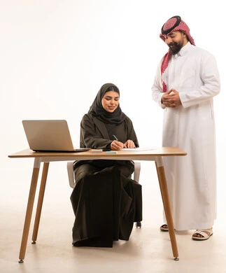Saudi Businesswoman Signing Documents in Office Studio