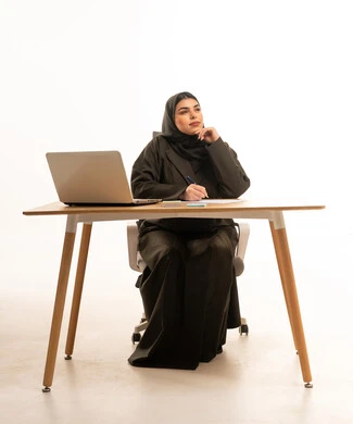 Saudi Businesswoman Thinking at Office Desk